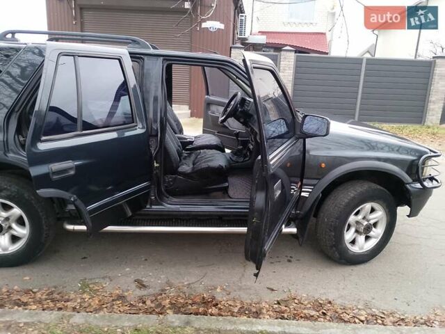 Черный Опель Фронтера, объемом двигателя 2.2 л и пробегом 329 тыс. км за 4999 $, фото 1 на Automoto.ua