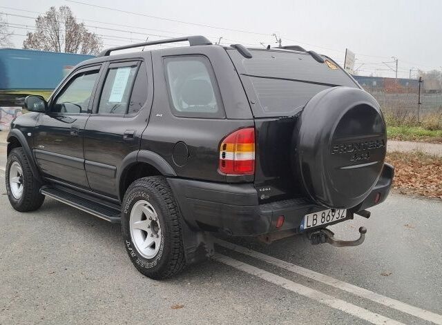 Чорний Опель Фронтера, об'ємом двигуна 2.2 л та пробігом 290 тис. км за 2100 $, фото 4 на Automoto.ua