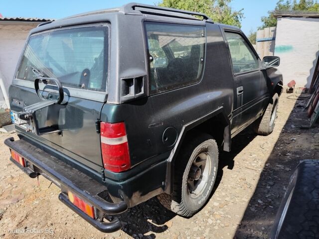 Зеленый Опель Фронтера, объемом двигателя 2 л и пробегом 25 тыс. км за 4000 $, фото 3 на Automoto.ua