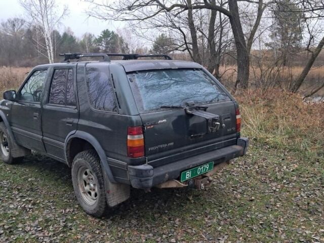 Зелений Опель Фронтера, об'ємом двигуна 2.3 л та пробігом 315 тис. км за 1899 $, фото 4 на Automoto.ua