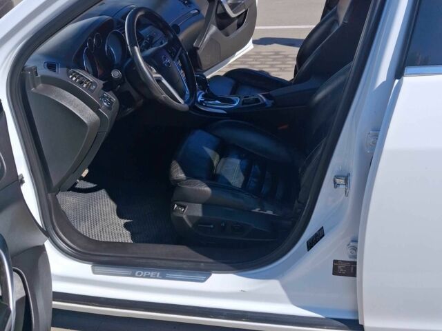 Білий Опель Інсігнія, об'ємом двигуна 2 л та пробігом 172 тис. км за 7700 $, фото 9 на Automoto.ua