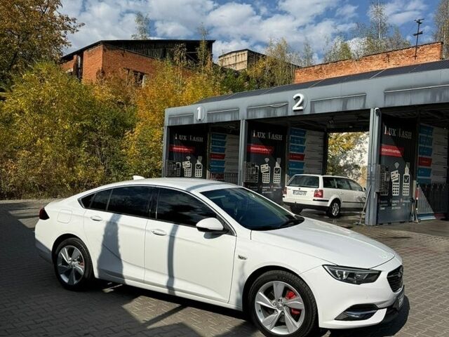 Білий Опель Інсігнія, об'ємом двигуна 1.96 л та пробігом 230 тис. км за 13700 $, фото 4 на Automoto.ua