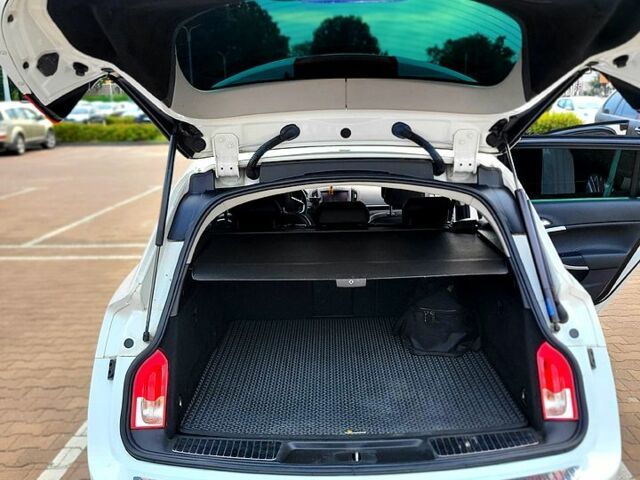 Білий Опель Інсігнія, об'ємом двигуна 2 л та пробігом 201 тис. км за 12450 $, фото 1 на Automoto.ua