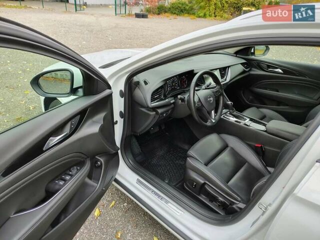 Білий Опель Інсігнія, об'ємом двигуна 2 л та пробігом 245 тис. км за 15700 $, фото 8 на Automoto.ua