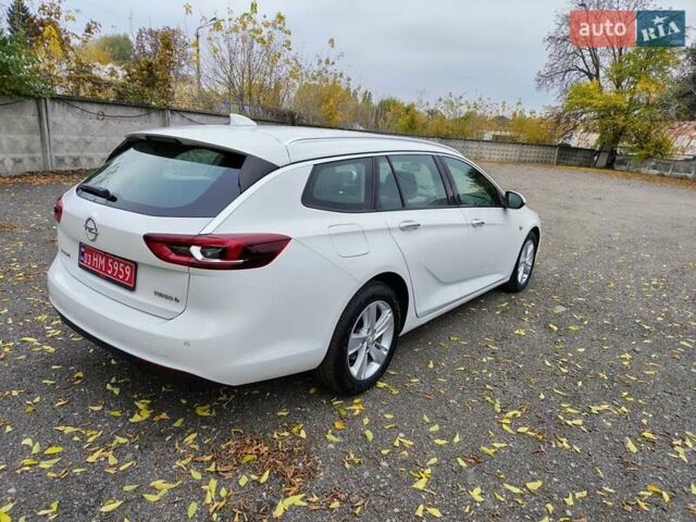 Білий Опель Інсігнія, об'ємом двигуна 2 л та пробігом 245 тис. км за 15700 $, фото 4 на Automoto.ua