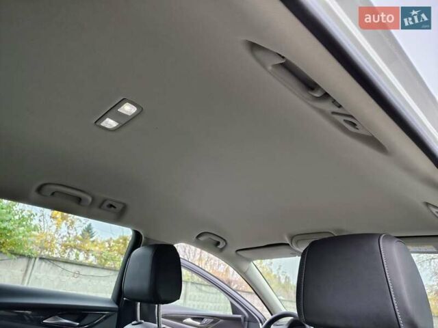 Білий Опель Інсігнія, об'ємом двигуна 2 л та пробігом 245 тис. км за 15700 $, фото 13 на Automoto.ua