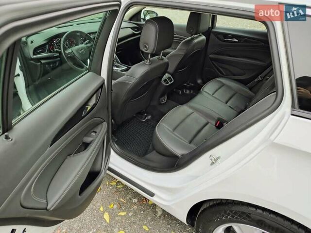 Білий Опель Інсігнія, об'ємом двигуна 2 л та пробігом 245 тис. км за 15700 $, фото 7 на Automoto.ua