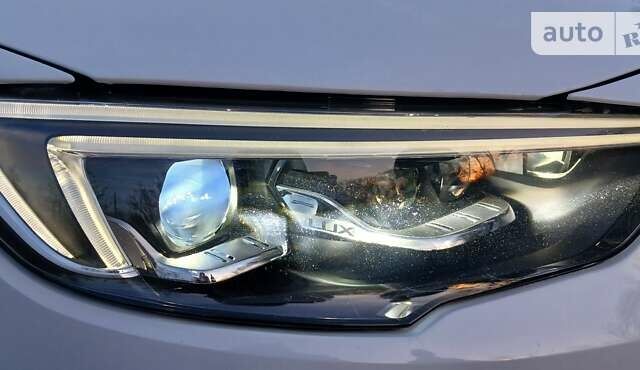 Білий Опель Інсігнія, об'ємом двигуна 1.6 л та пробігом 153 тис. км за 16545 $, фото 12 на Automoto.ua