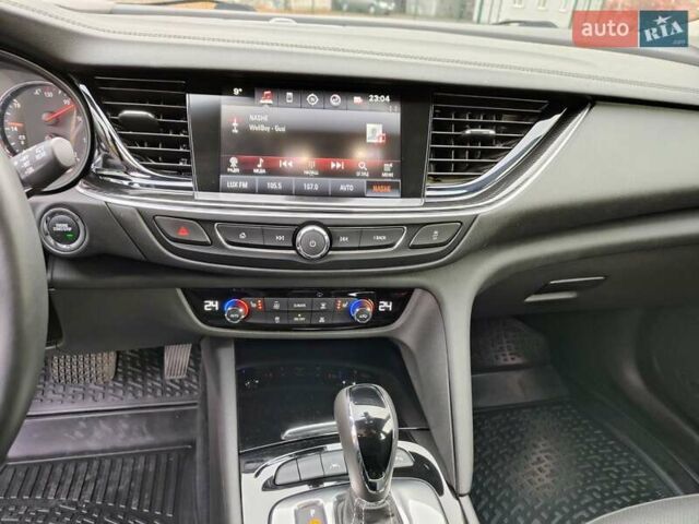 Білий Опель Інсігнія, об'ємом двигуна 2 л та пробігом 245 тис. км за 15700 $, фото 20 на Automoto.ua