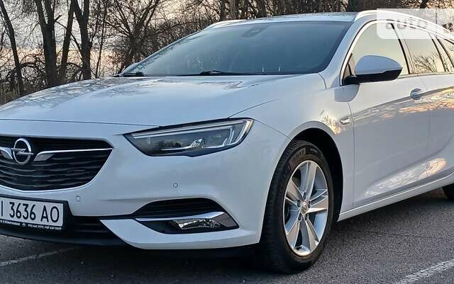 Білий Опель Інсігнія, об'ємом двигуна 1.6 л та пробігом 153 тис. км за 16545 $, фото 6 на Automoto.ua