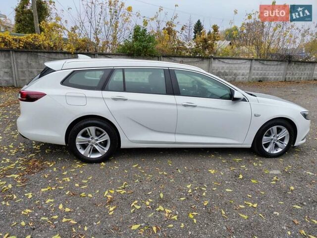 Білий Опель Інсігнія, об'ємом двигуна 2 л та пробігом 245 тис. км за 15700 $, фото 5 на Automoto.ua