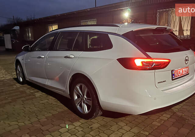 Білий Опель Інсігнія, об'ємом двигуна 1.96 л та пробігом 149 тис. км за 15500 $, фото 5 на Automoto.ua