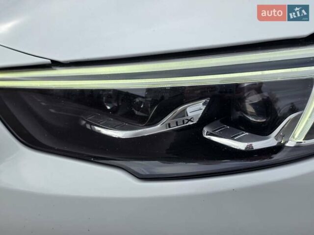 Білий Опель Інсігнія, об'ємом двигуна 2 л та пробігом 225 тис. км за 16500 $, фото 11 на Automoto.ua