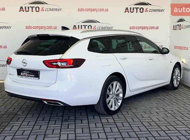 Білий Опель Інсігнія, об'ємом двигуна 1.96 л та пробігом 145 тис. км за 19750 $, фото 2 на Automoto.ua