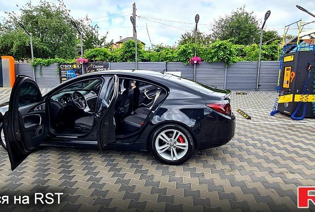 Чорний Опель Інсігнія, об'ємом двигуна 2 л та пробігом 25800 тис. км за 7300 $, фото 5 на Automoto.ua