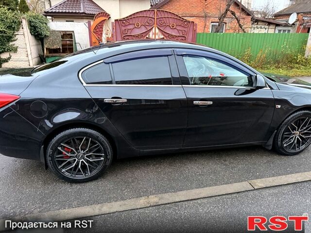 Чорний Опель Інсігнія, об'ємом двигуна 2 л та пробігом 209 тис. км за 7500 $, фото 1 на Automoto.ua