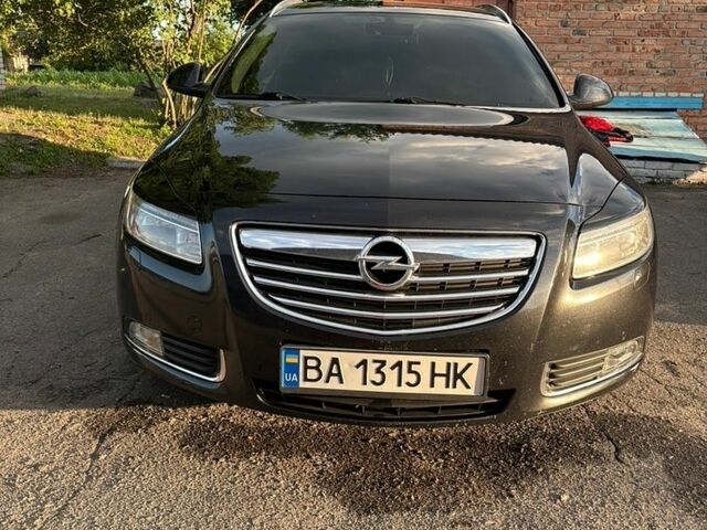 Черный Опель Инсигния, объемом двигателя 2 л и пробегом 324 тыс. км за 7200 $, фото 1 на Automoto.ua