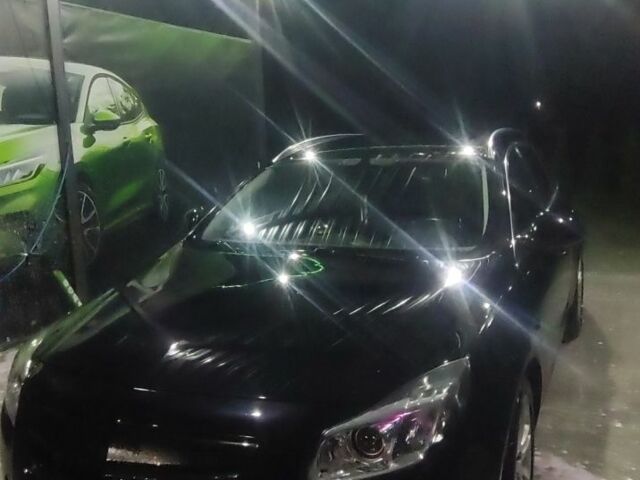 Черный Опель Инсигния, объемом двигателя 2 л и пробегом 328 тыс. км за 3200 $, фото 1 на Automoto.ua