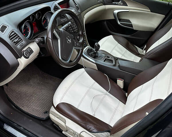 Черный Опель Инсигния, объемом двигателя 2 л и пробегом 266 тыс. км за 7600 $, фото 1 на Automoto.ua