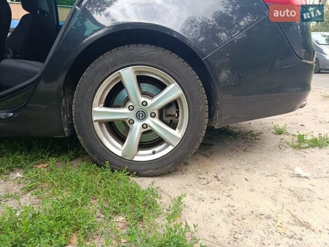 Черный Опель Инсигния, объемом двигателя 1.96 л и пробегом 236 тыс. км за 7500 $, фото 7 на Automoto.ua