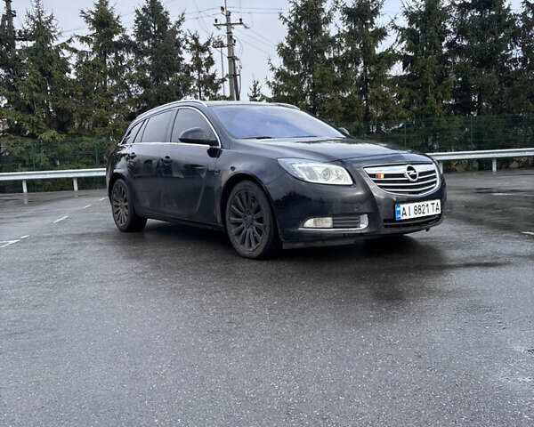 Черный Опель Инсигния, объемом двигателя 2 л и пробегом 265 тыс. км за 7250 $, фото 1 на Automoto.ua
