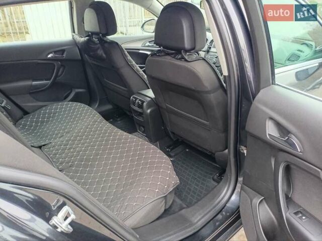 Чорний Опель Інсігнія, об'ємом двигуна 1.96 л та пробігом 179 тис. км за 6399 $, фото 14 на Automoto.ua