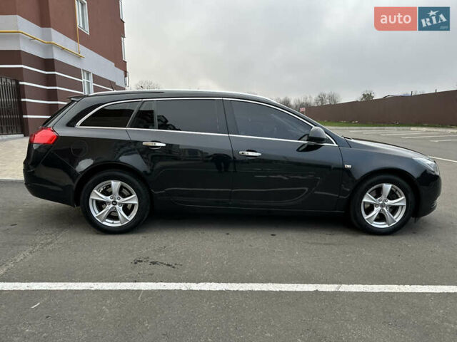 Черный Опель Инсигния, объемом двигателя 2 л и пробегом 194 тыс. км за 7500 $, фото 3 на Automoto.ua