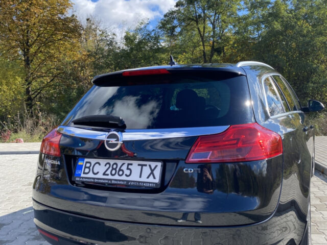 Чорний Опель Інсігнія, об'ємом двигуна 1.96 л та пробігом 231 тис. км за 6650 $, фото 2 на Automoto.ua