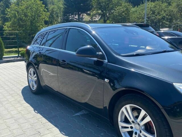 Чорний Опель Інсігнія, об'ємом двигуна 2 л та пробігом 250 тис. км за 5999 $, фото 2 на Automoto.ua