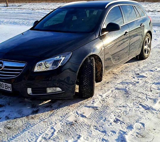Черный Опель Инсигния, объемом двигателя 1.8 л и пробегом 24000 тыс. км за 6500 $, фото 2 на Automoto.ua