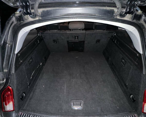 Чорний Опель Інсігнія, об'ємом двигуна 1.96 л та пробігом 215 тис. км за 7777 $, фото 6 на Automoto.ua