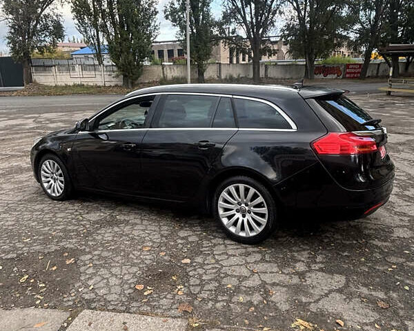 Черный Опель Инсигния, объемом двигателя 1.96 л и пробегом 333 тыс. км за 9950 $, фото 1 на Automoto.ua