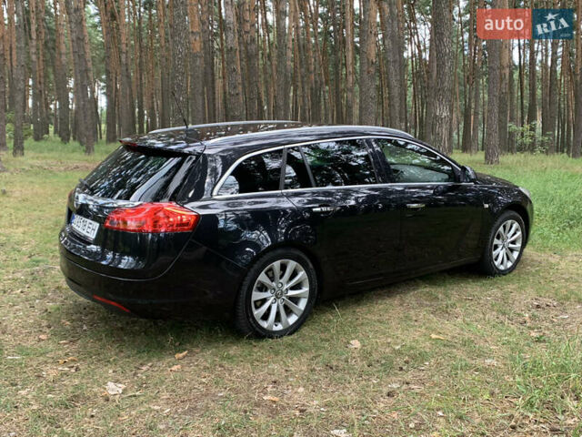 Чорний Опель Інсігнія, об'ємом двигуна 2 л та пробігом 265 тис. км за 8600 $, фото 1 на Automoto.ua