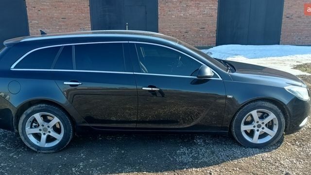 Чорний Опель Інсігнія, об'ємом двигуна 1.96 л та пробігом 225 тис. км за 6850 $, фото 9 на Automoto.ua