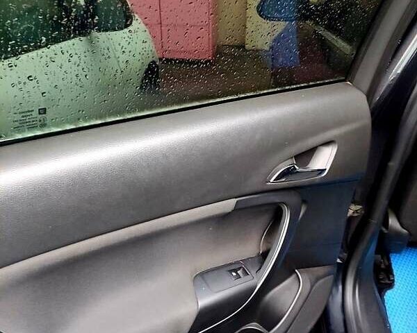 Чорний Опель Інсігнія, об'ємом двигуна 2 л та пробігом 250 тис. км за 7999 $, фото 7 на Automoto.ua