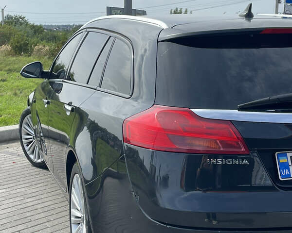 Чорний Опель Інсігнія, об'ємом двигуна 1.96 л та пробігом 256 тис. км за 8175 $, фото 14 на Automoto.ua