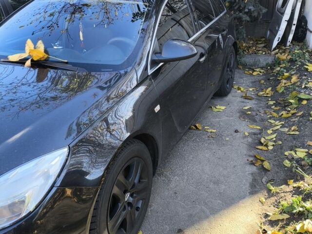 Черный Опель Инсигния, объемом двигателя 2 л и пробегом 304 тыс. км за 7700 $, фото 1 на Automoto.ua