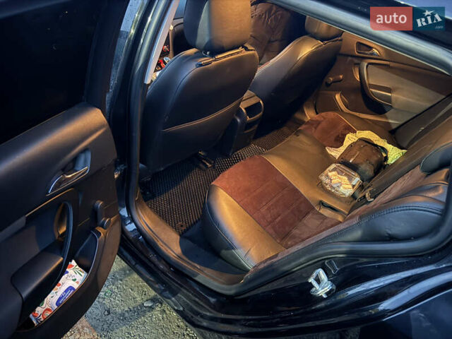 Чорний Опель Інсігнія, об'ємом двигуна 1.96 л та пробігом 205 тис. км за 8000 $, фото 13 на Automoto.ua