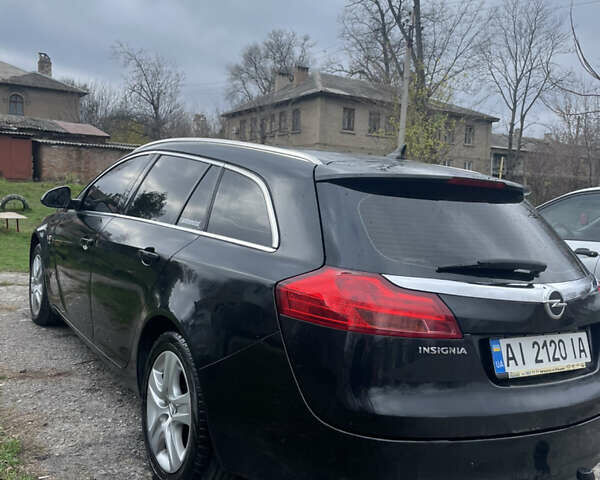 Чорний Опель Інсігнія, об'ємом двигуна 2 л та пробігом 220 тис. км за 7500 $, фото 1 на Automoto.ua
