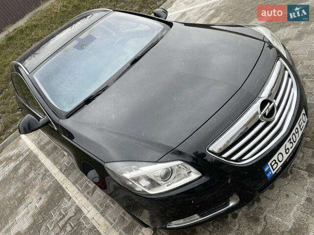 Черный Опель Инсигния, объемом двигателя 2 л и пробегом 180 тыс. км за 9400 $, фото 1 на Automoto.ua