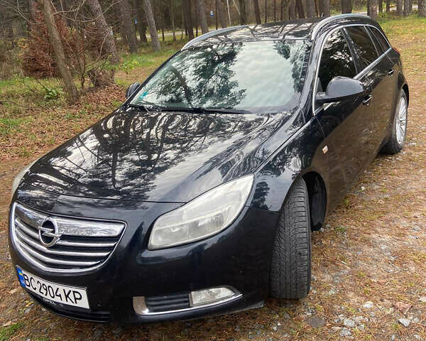 Черный Опель Инсигния, объемом двигателя 2 л и пробегом 270 тыс. км за 8800 $, фото 1 на Automoto.ua