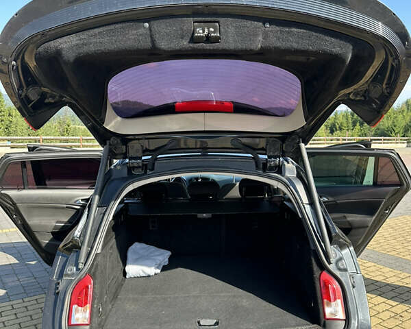 Черный Опель Инсигния, объемом двигателя 2 л и пробегом 299 тыс. км за 7799 $, фото 4 на Automoto.ua