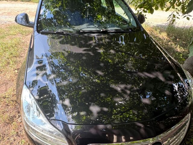 Черный Опель Инсигния, объемом двигателя 2 л и пробегом 254 тыс. км за 7300 $, фото 2 на Automoto.ua