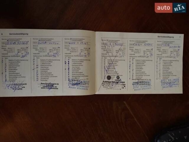 Чорний Опель Інсігнія, об'ємом двигуна 2 л та пробігом 198 тис. км за 12100 $, фото 32 на Automoto.ua