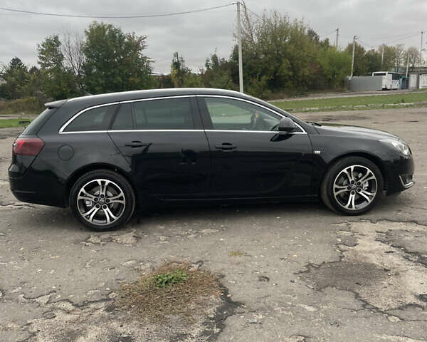 Чорний Опель Інсігнія, об'ємом двигуна 2 л та пробігом 233 тис. км за 12888 $, фото 6 на Automoto.ua