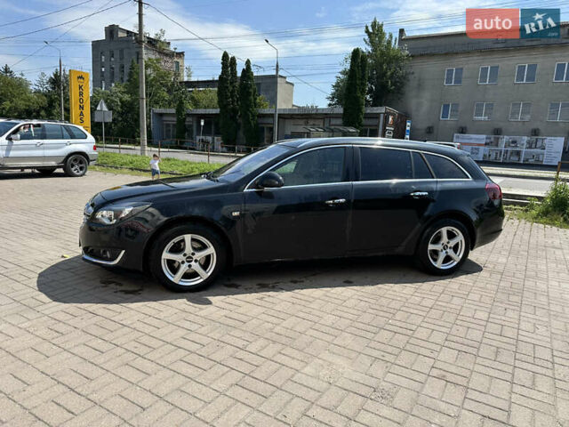 Чорний Опель Інсігнія, об'ємом двигуна 2 л та пробігом 252 тис. км за 10600 $, фото 2 на Automoto.ua