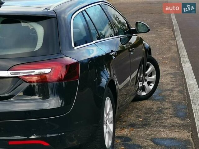 Чорний Опель Інсігнія, об'ємом двигуна 1.96 л та пробігом 205 тис. км за 12999 $, фото 6 на Automoto.ua