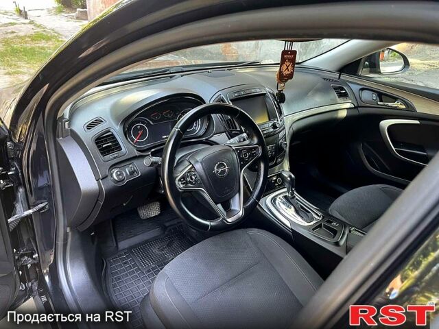 Черный Опель Инсигния, объемом двигателя 2 л и пробегом 218 тыс. км за 10500 $, фото 1 на Automoto.ua