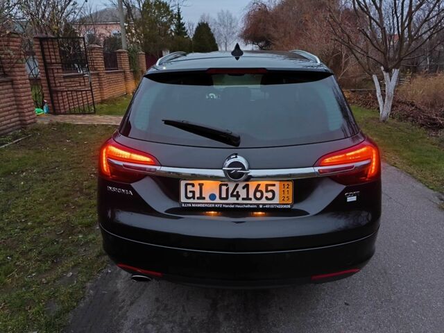 Чорний Опель Інсігнія, об'ємом двигуна 2 л та пробігом 255 тис. км за 10999 $, фото 5 на Automoto.ua