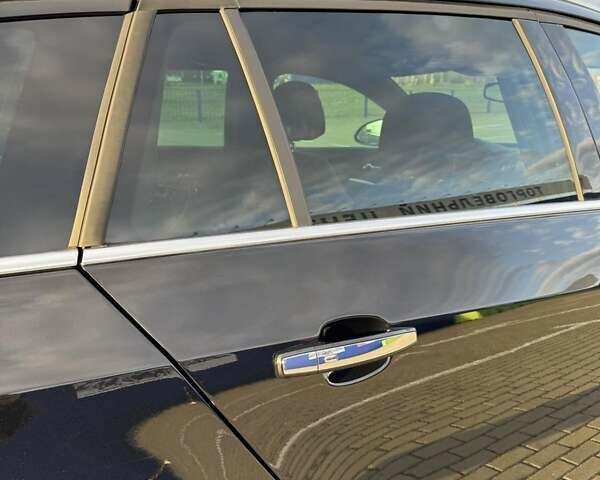 Черный Опель Инсигния, объемом двигателя 2 л и пробегом 160 тыс. км за 11900 $, фото 2 на Automoto.ua